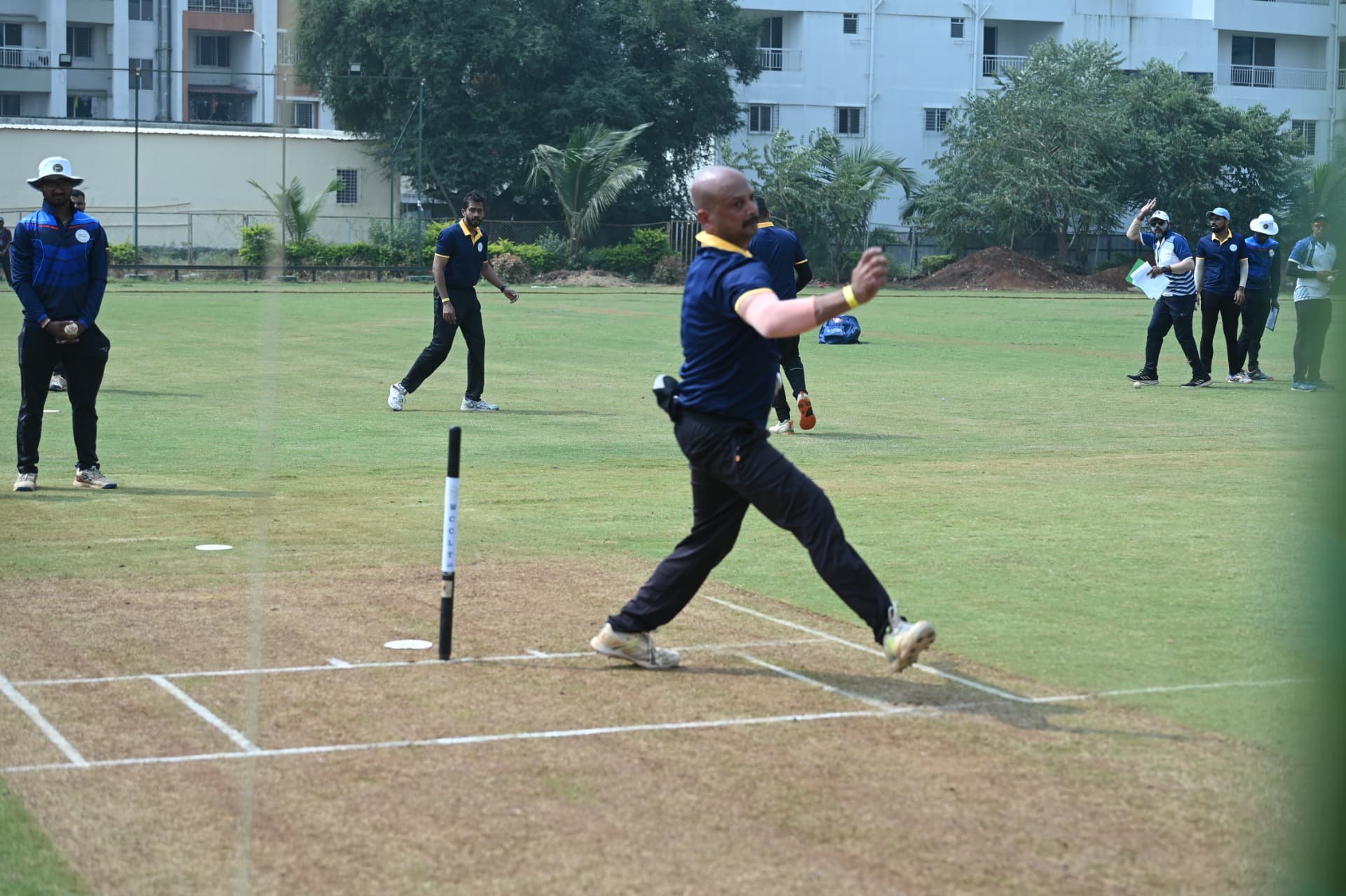 A bowler in full delivery stride at the WCCL Season I Pune trials