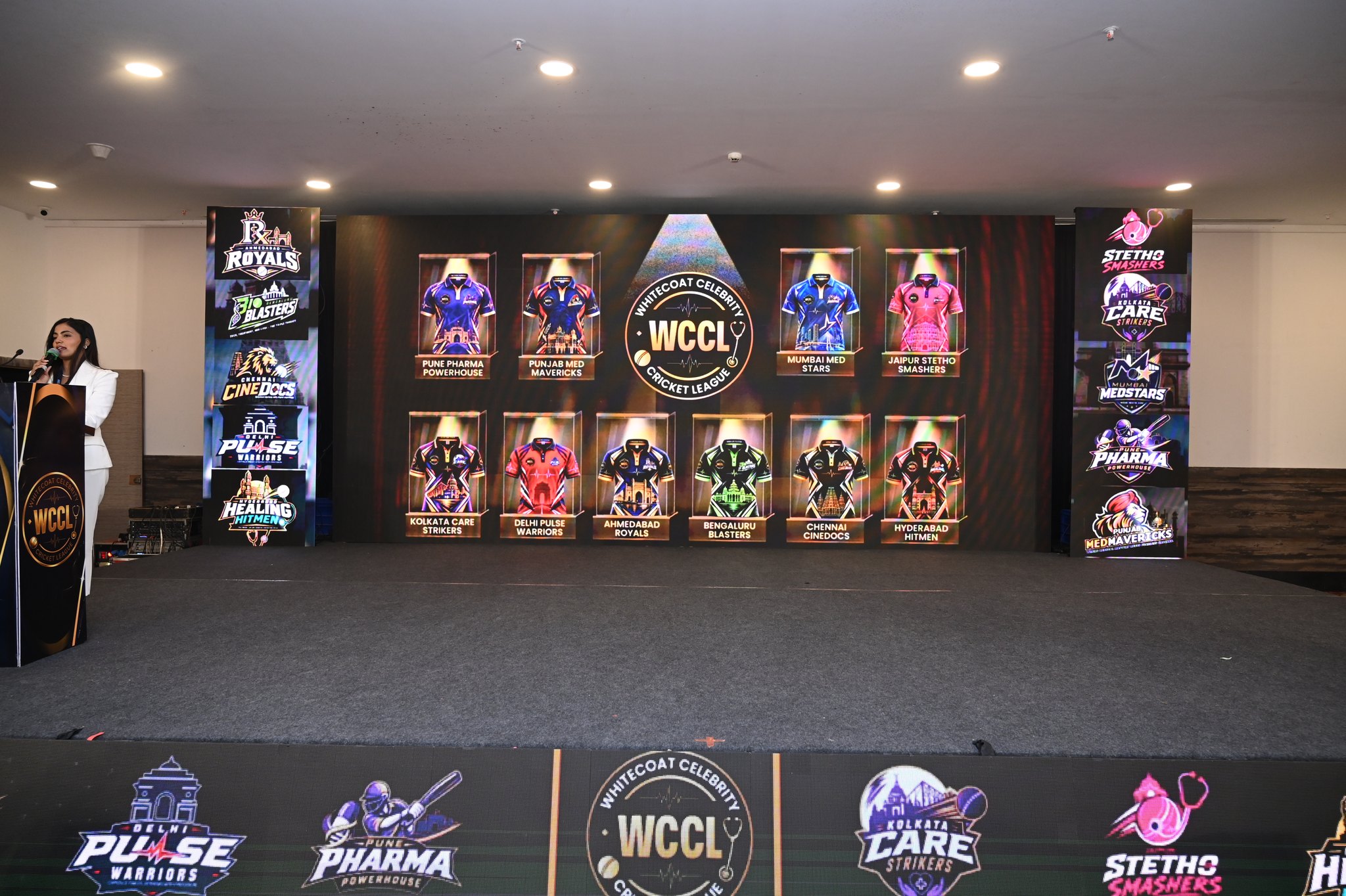 The Grand Auction stage showing all ten Season I team jerseys