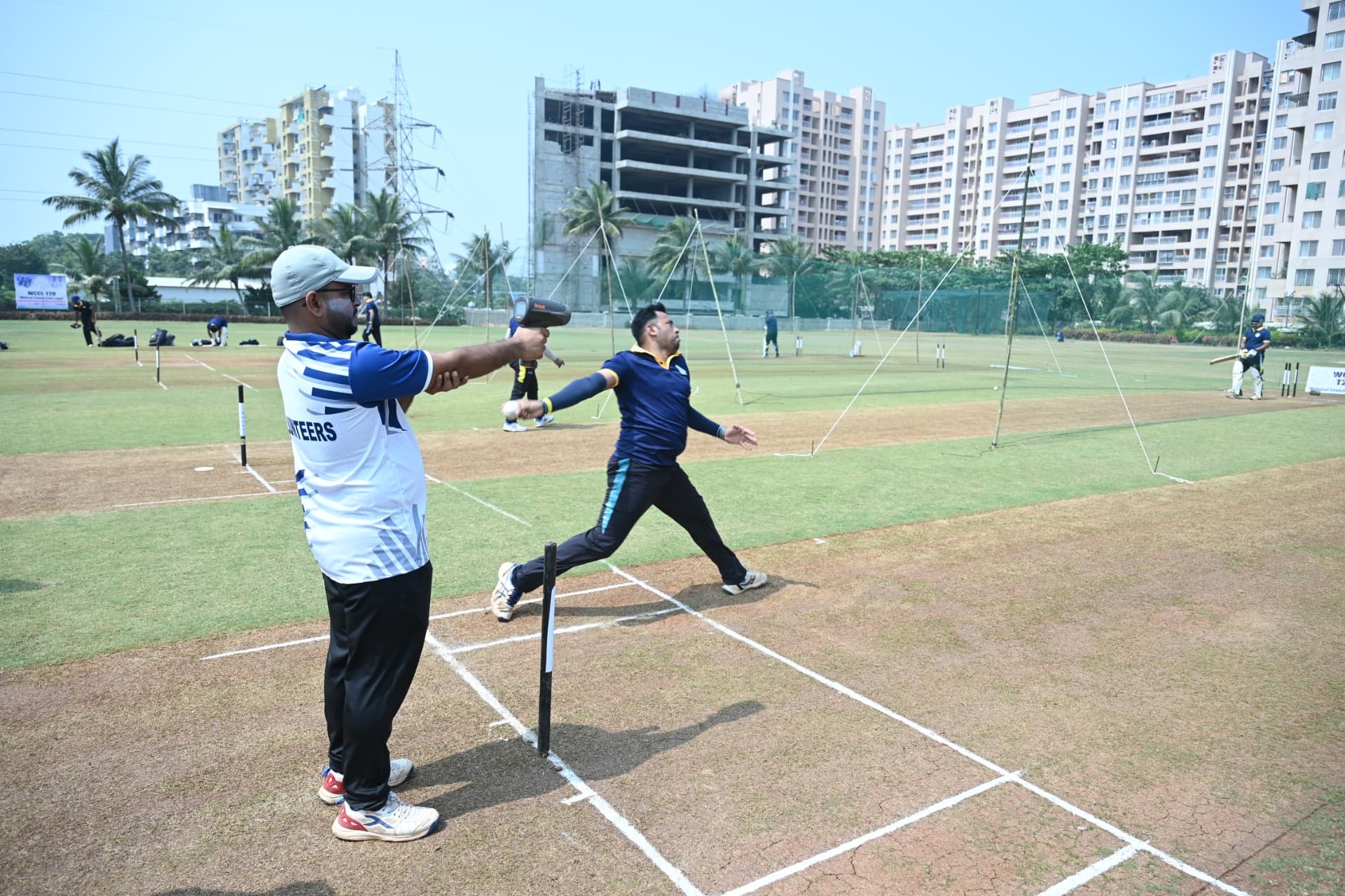 A batter and bowler in action on the pitch at the WCCL Pune trials