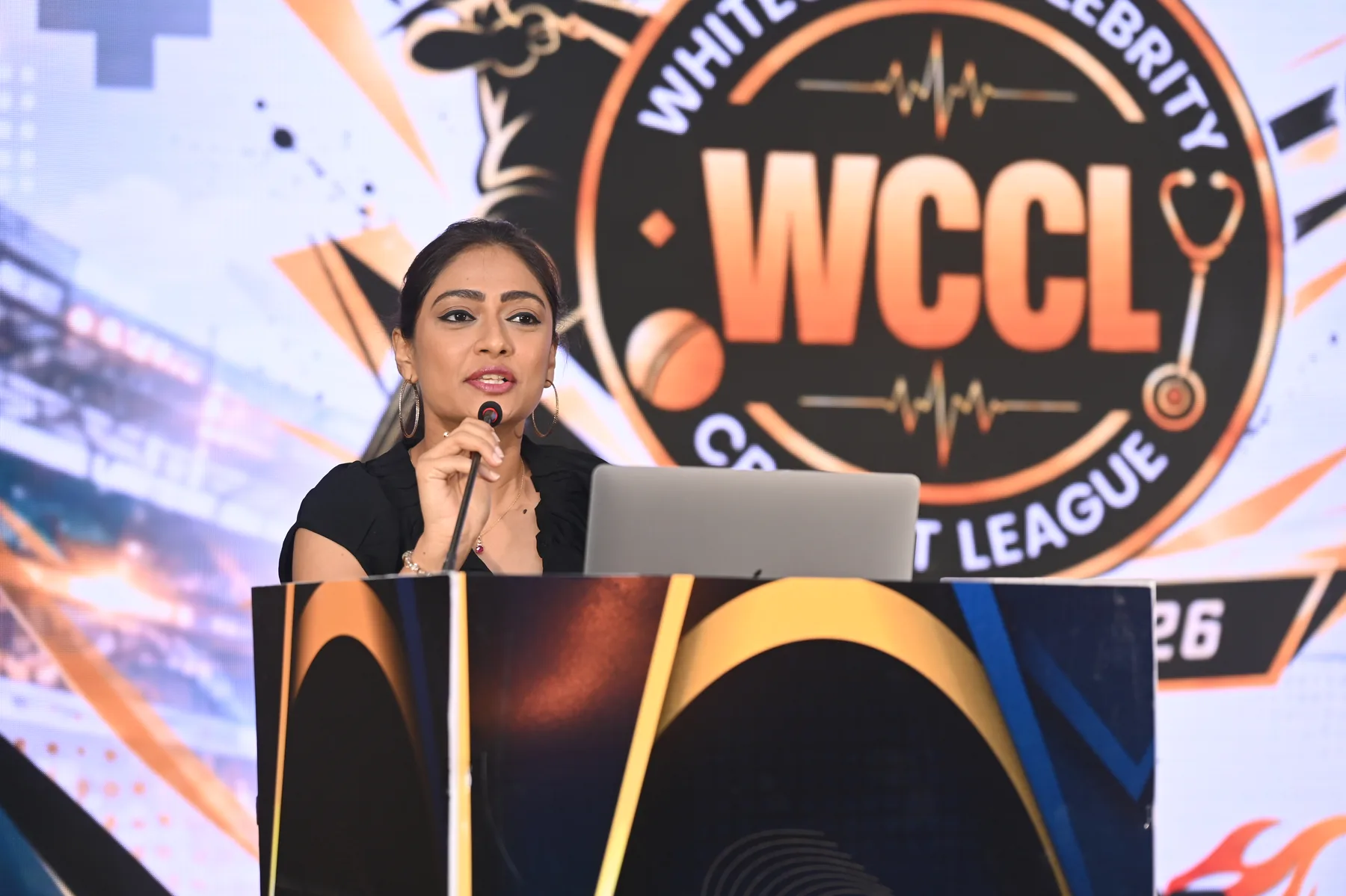 Speaker on the WCCL auction stage